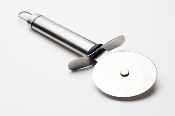 shiny metal pizza cutter isolated