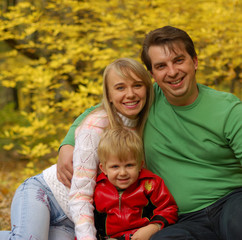 Family in autumn forest