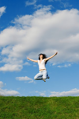 Obraz premium pretty young woman is jumping