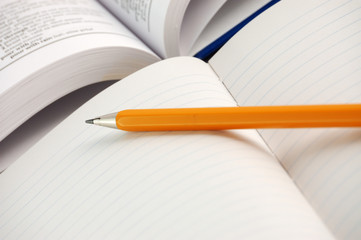 Dictionary with notebook and pencil