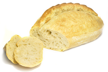 The cut loaf of bread isolated on white