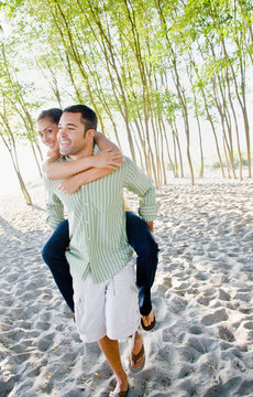 Boyfriend Giving Girlfriend Piggy Back Ride