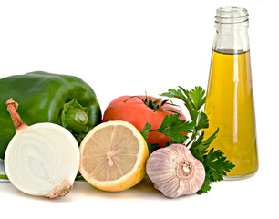 Vegetables, herbs, lemon anf olive oil  ready to be processed to