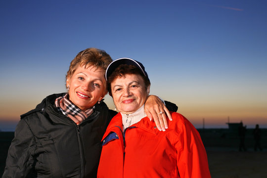 A Portrait Of Mother And Daughter At Sunset