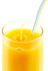 drops falling down to orange juice