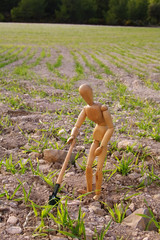 peasant in a field with shovel