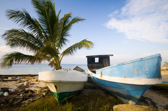 fishing boats on shore caribbean sea