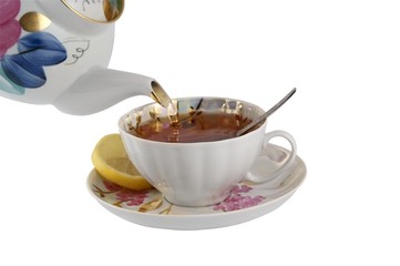 Cup of tea with teapot on white