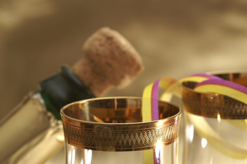 Detail of champagne bottle with glass