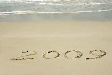 2009 writing on the sand beach