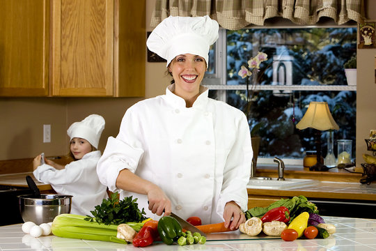 Woman Chef chopping vegetables