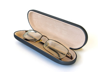 Glasses in spectacle case on white