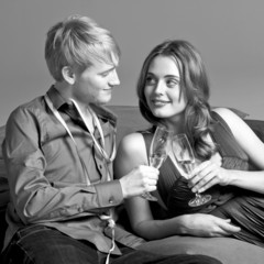 young couple drinking champagne, b/w