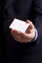 Hand of businessman offering businesscard