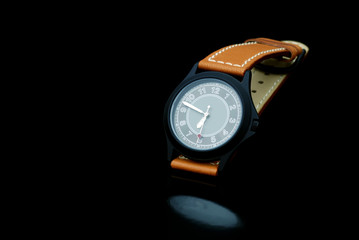 Classic Watch on a black background with a reflection