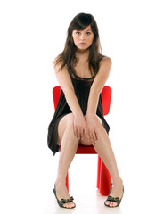 Girl on a toy chair