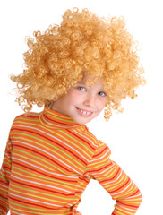 Portrait of smiling girl in red curly wig.