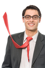 Happy successful businessman with red tie, isolated