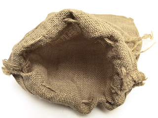 Fototapeta na wymiar open beige linen sack with the braids