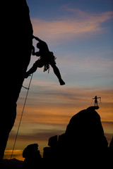 Rock climber silhouetted.
