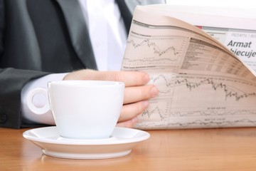businessman read business news and drinking coffee