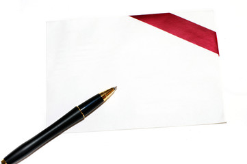 Diagonal red gift bow and blank card on white background