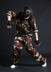 young woman dancing in camouflage