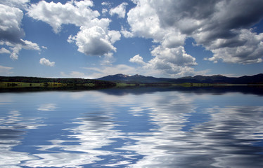 Cloudy sky with reflection