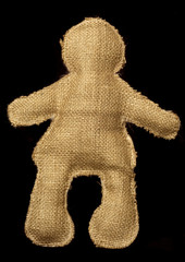 muñeco de tela fondo negro