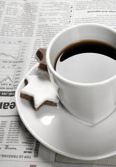 Coffee and financial newspaper