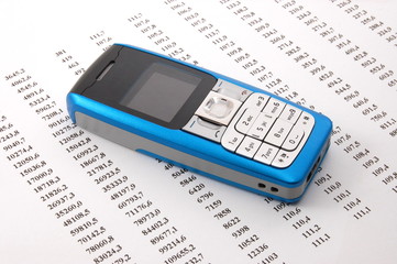 cell phone over business chart