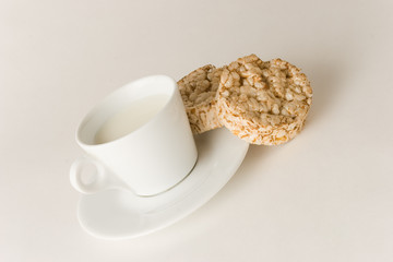 Cup of coffee with milk and cookies