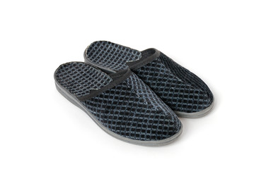 Two grey slippers isolated on white