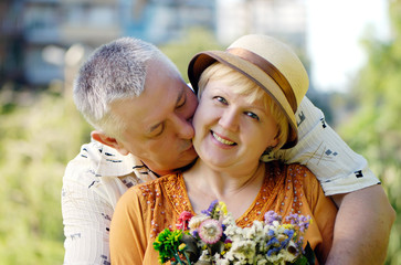 Senior couple smiling in the park
