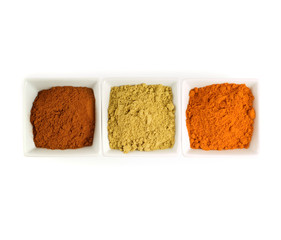 Colorful spices in square dishes