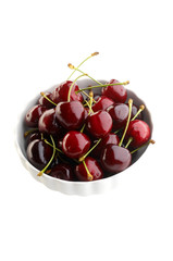 Fresh cherries in white bowl