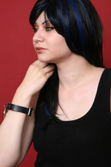 Blue haired punk girl on red background