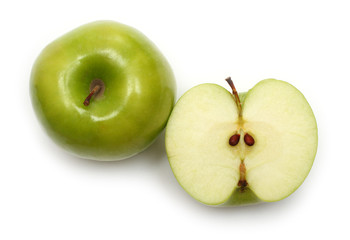 whole and sliced green apples