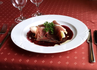 Dish of Italian cuisine -  parma  in sauce with geenery