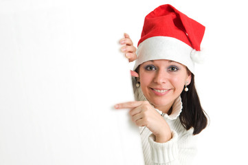 Young attractive brunette pointing to empty board