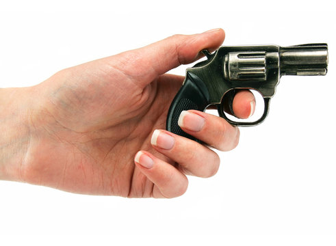 Small revolver gun in female hand
