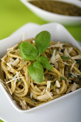 Italian pasta spaghetti with pesto sause and parmesan.