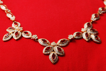 Gold necklace with ruby gem