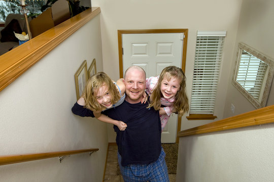 Father And His Kids Climbing Stairs