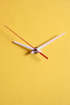 Yellow papery clock dial with moving second hand