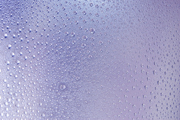 Water drops on blue glass