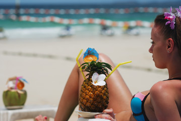 Girl with tropical cocktail