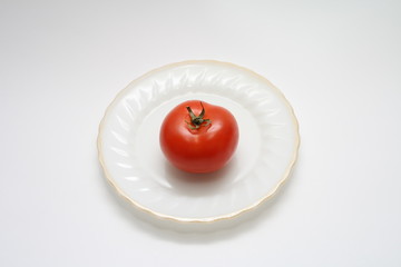 Tomato on the plate.