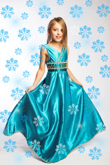Gala portrait of a little girl in blue gown