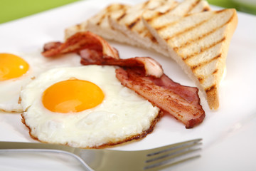 Breakfast - toasts, eggs, bacon